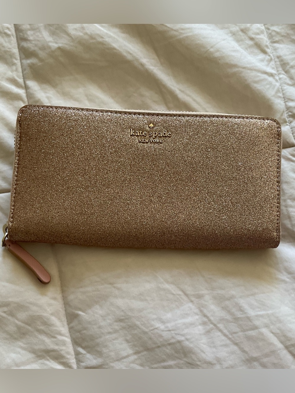 kate spade glitter zip-around wallet in rose gold